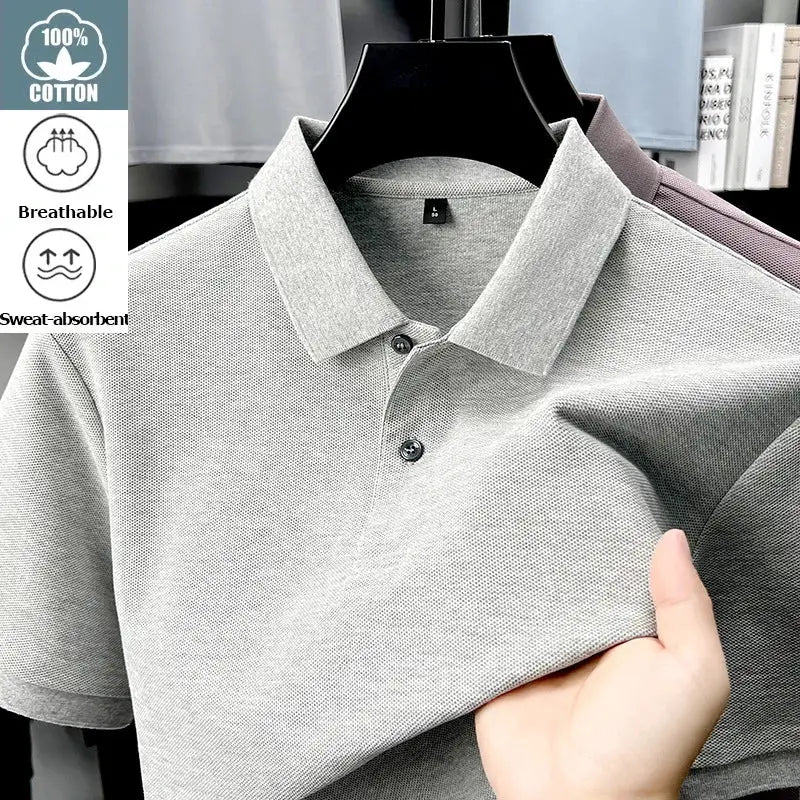 Men's light gray cotton polo shirt on hanger; breathable, sweat-absorbent fabric with polo collar and two-button placket