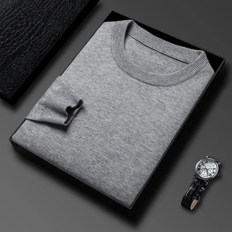 Men's gray round-neck knitted sweater in a black box, with a silver wristwatch beside it