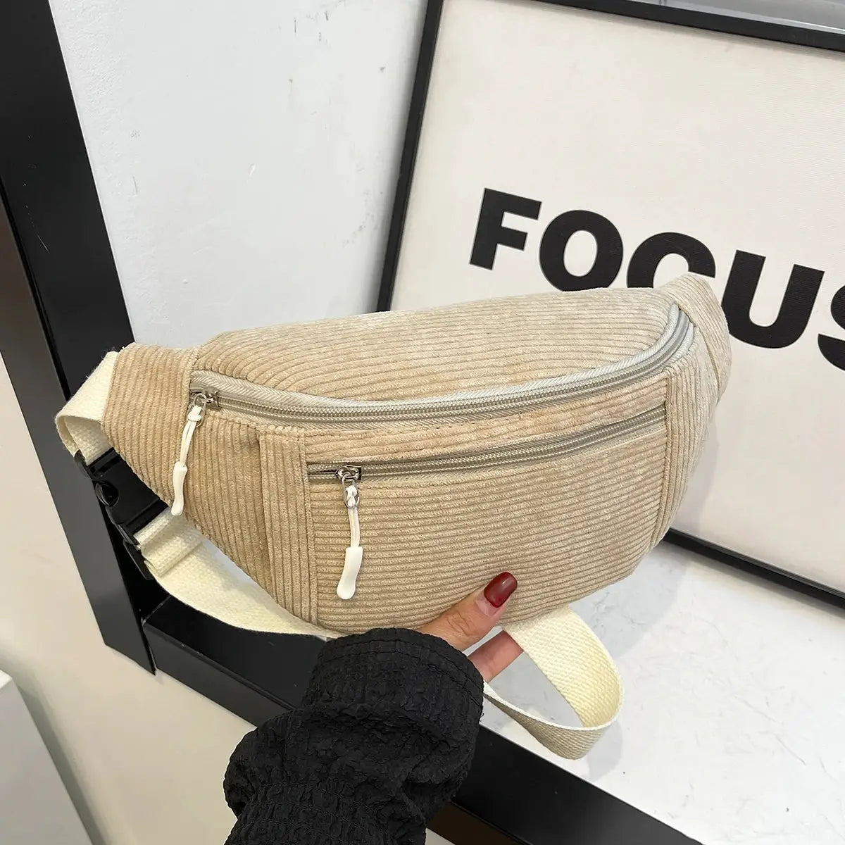 Corduroy waist bag by Simples Market; beige fanny pack with dual zip pockets and adjustable strap.
