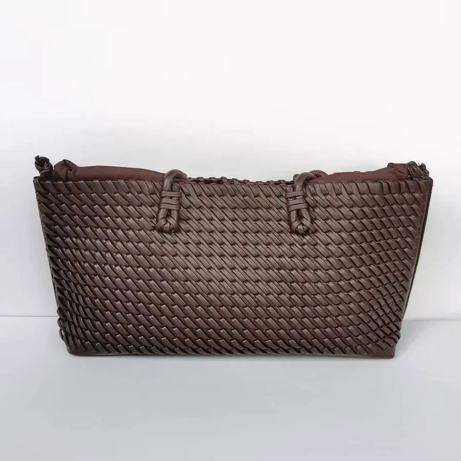 Brown woven tote bag by Simples Market with dual handles and large capacity.