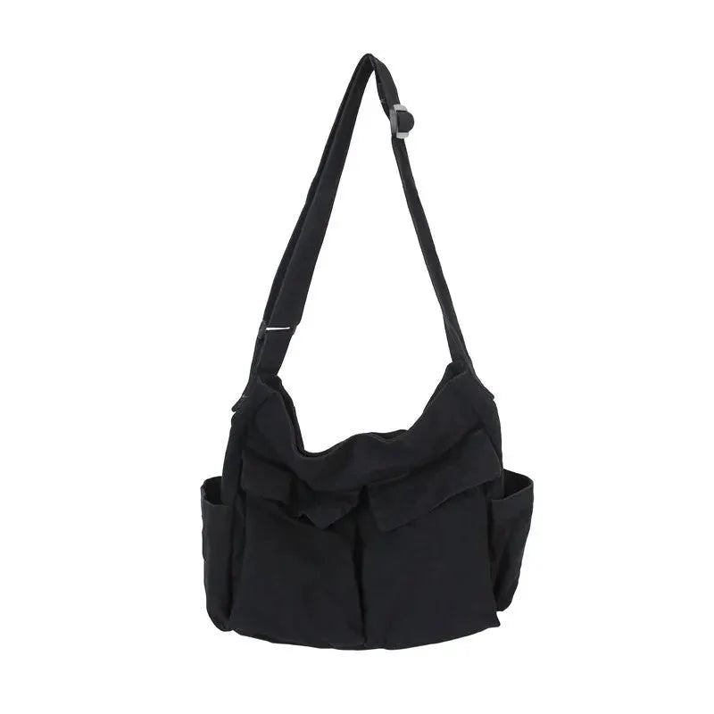 Simples Market black canvas messenger bag with adjustable strap, large capacity and side pockets