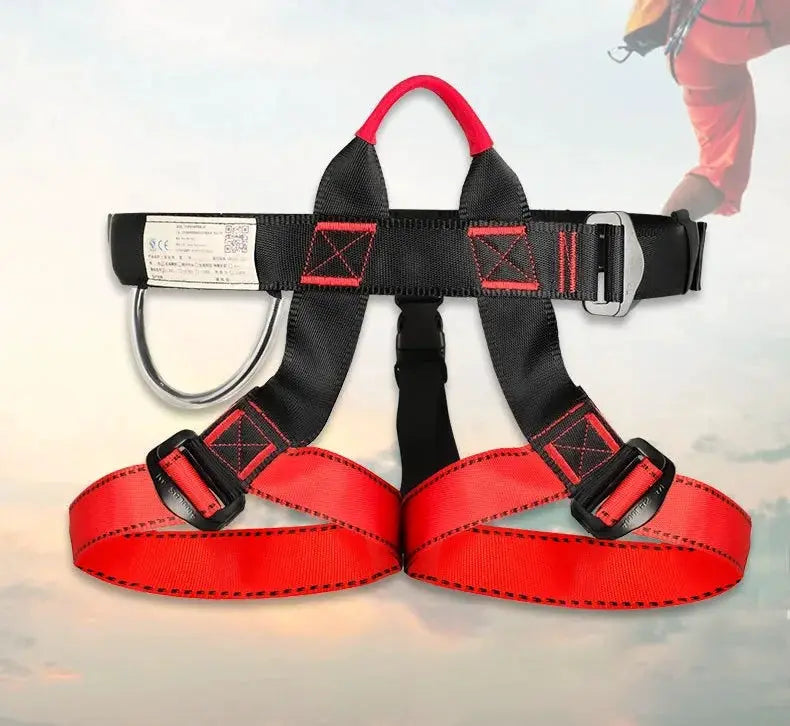 Simples Market half-body climbing harness with red leg loops and black waist belt, metal D-ring.