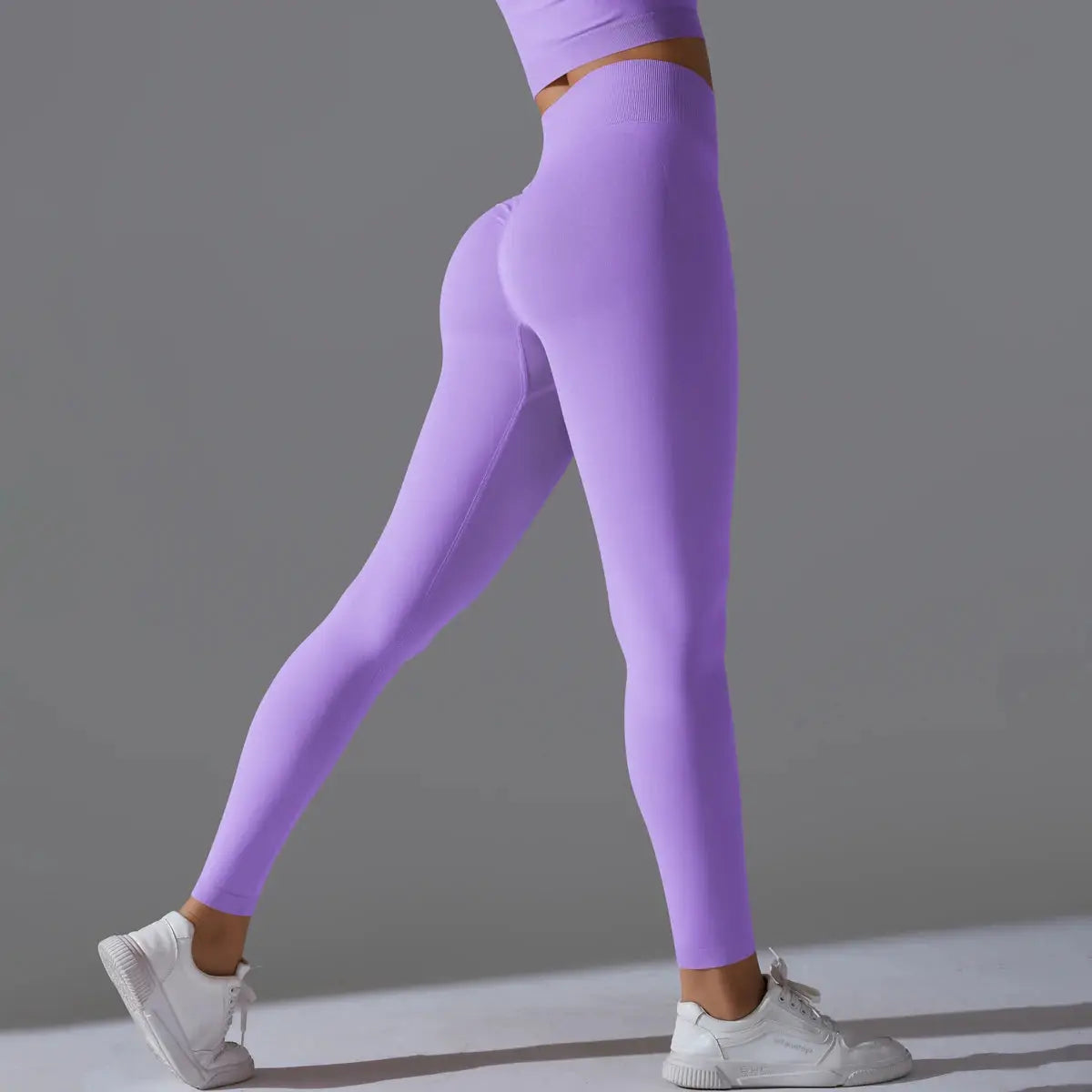 Women's seamless purple yoga leggings with high waist for tummy control and workouts