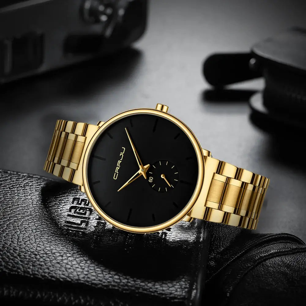 CRRJU men's gold-tone stainless steel watch with black dial and gold bracelet.