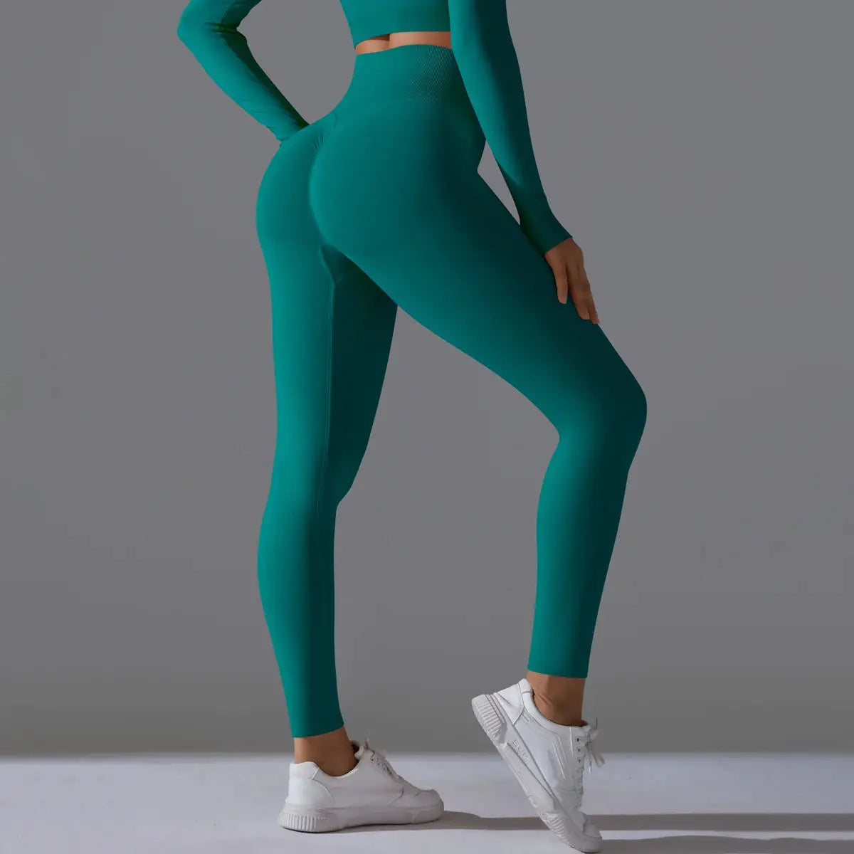 Women's seamless teal yoga leggings with high waist and tummy control, scrunch butt lift