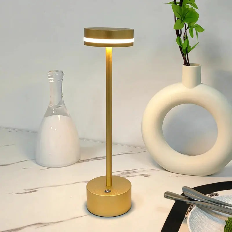 Touch Small Night Light LED aluminum desk lamp by Simples Market in gold finish with adjustable brightness.