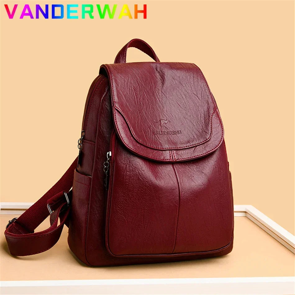 Genuine women's burgundy soft leather backpack with flap closure