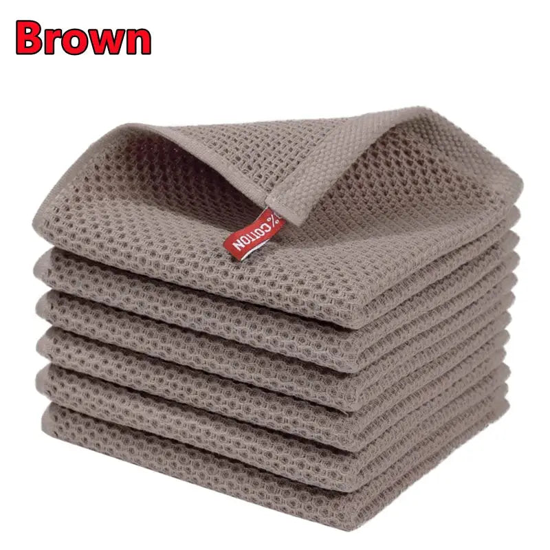 Brown 100% cotton dishcloths stacked; ultra-soft, highly absorbent kitchen towels.