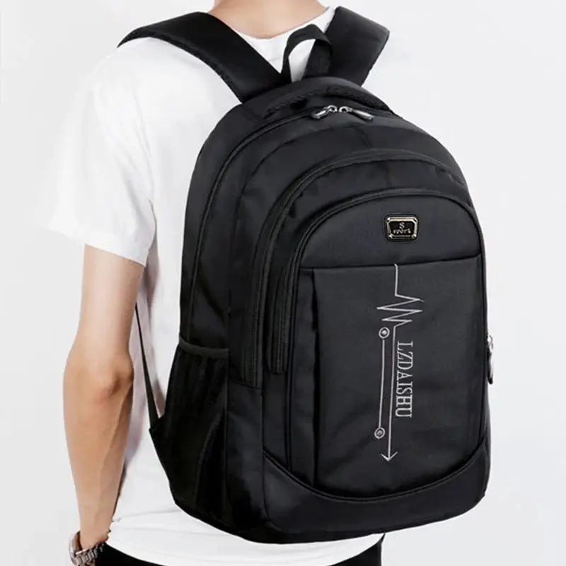 Simples Market black laptop backpack, business casual style with multiple compartments and front logo panel.