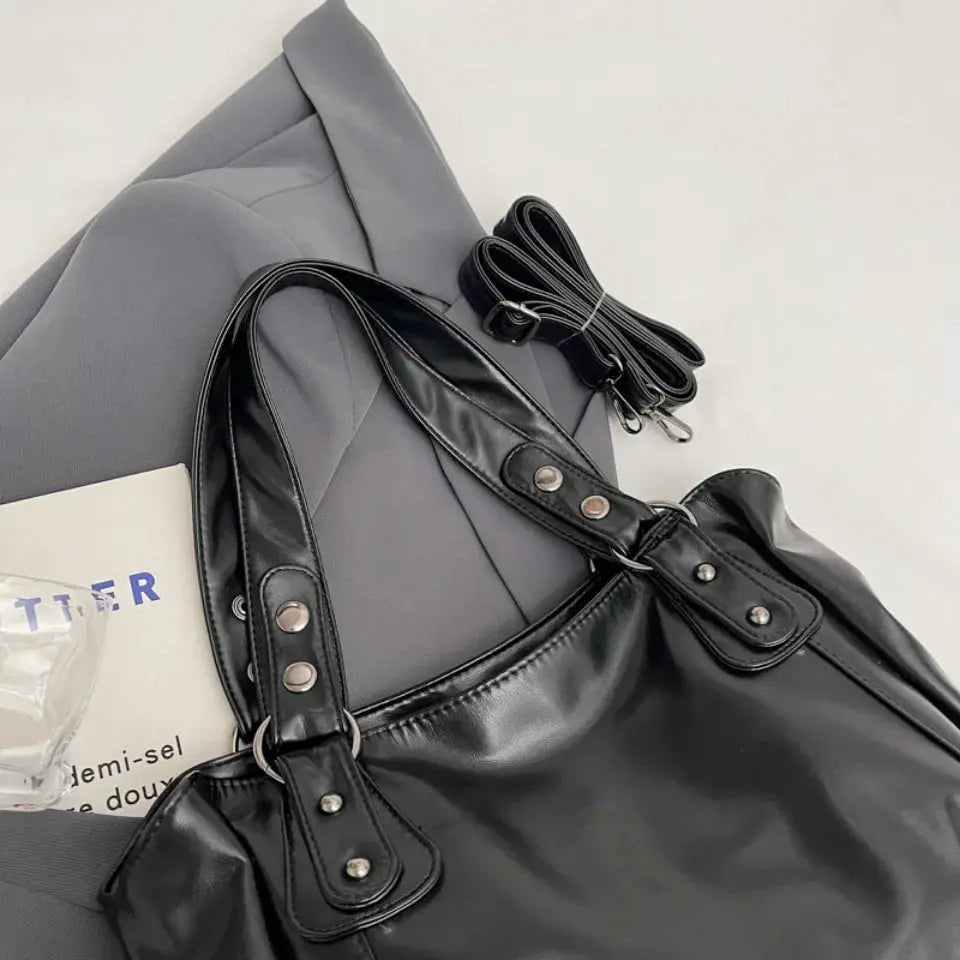 Roomy black PU leather shoulder bag with silver hardware and detachable strap