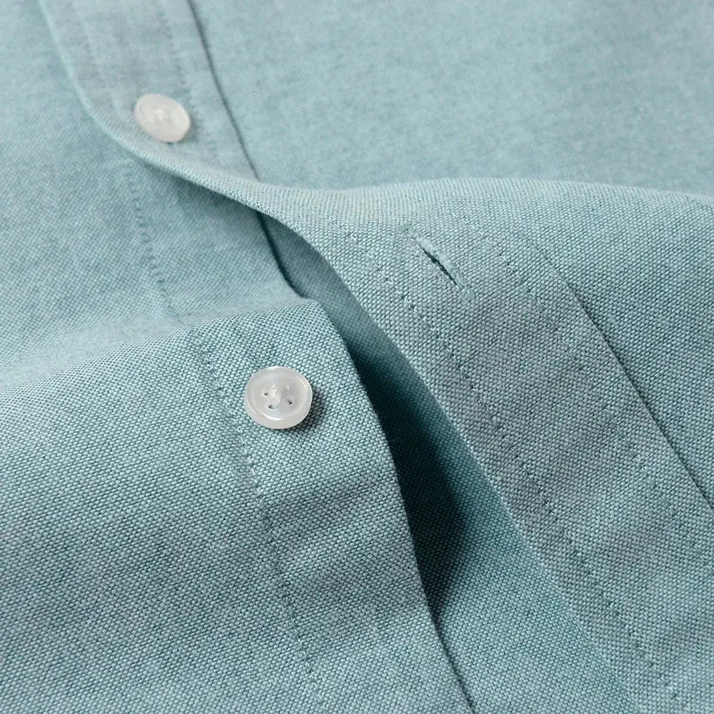Men's Slim-Fit Oxford Cotton Shirt in light teal with long sleeves and white buttons