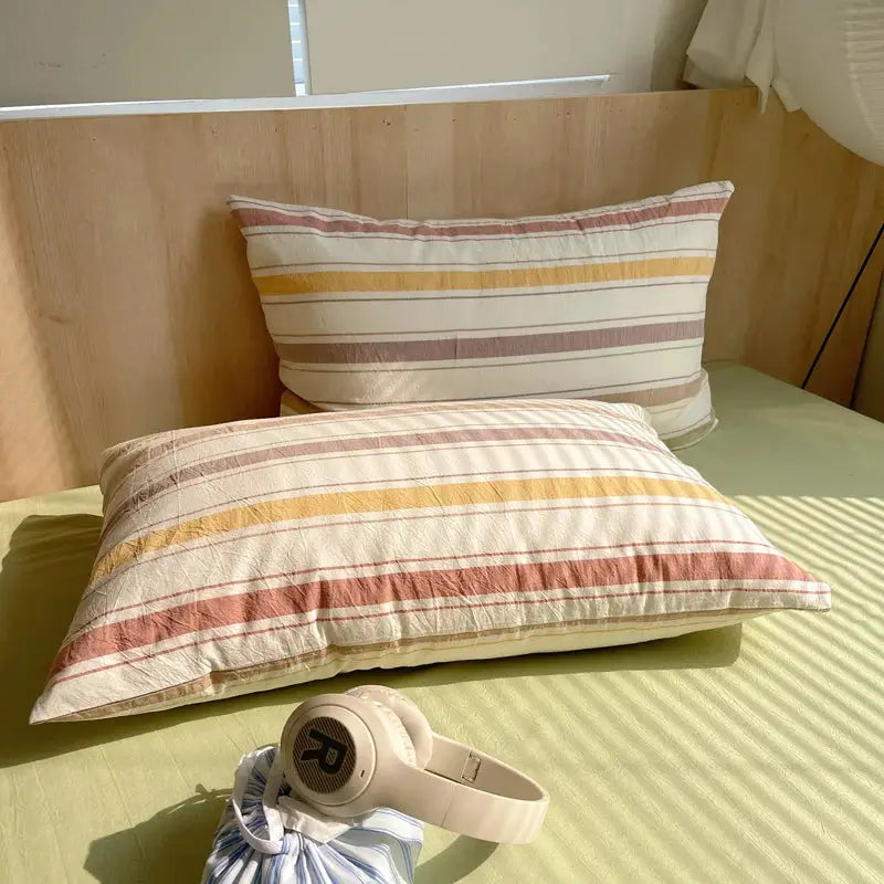 Striped 100% cotton bedding set with duvet cover and two pillowcases by Simples Market in warm beige, orange and brown
