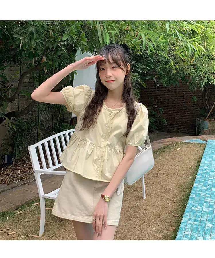 Women’s cream puff-sleeve peplum shirt with button front for casual summer look