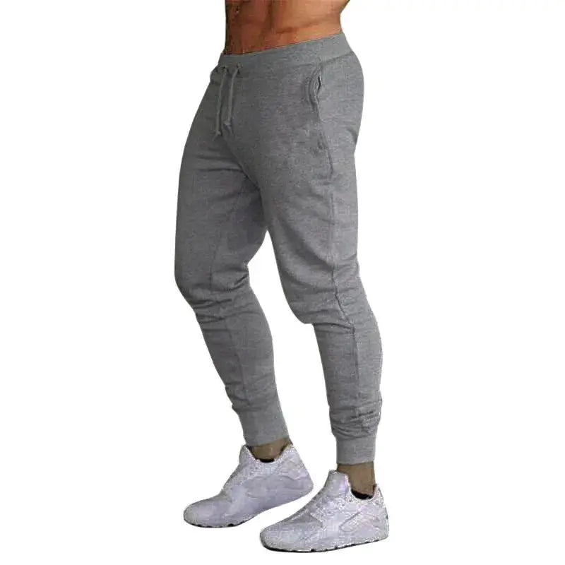 Men's gray loose straight-leg jogger pants with drawstring and ribbed cuffs