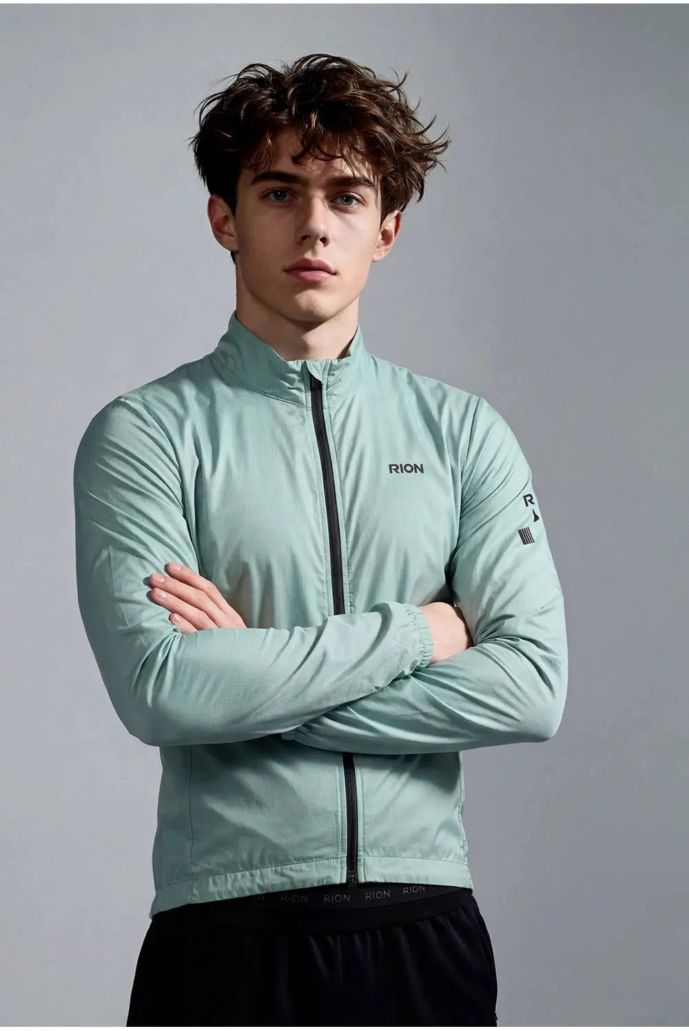 RION men's mint-green windbreaker jacket with front zip and stand-up collar, chest logo