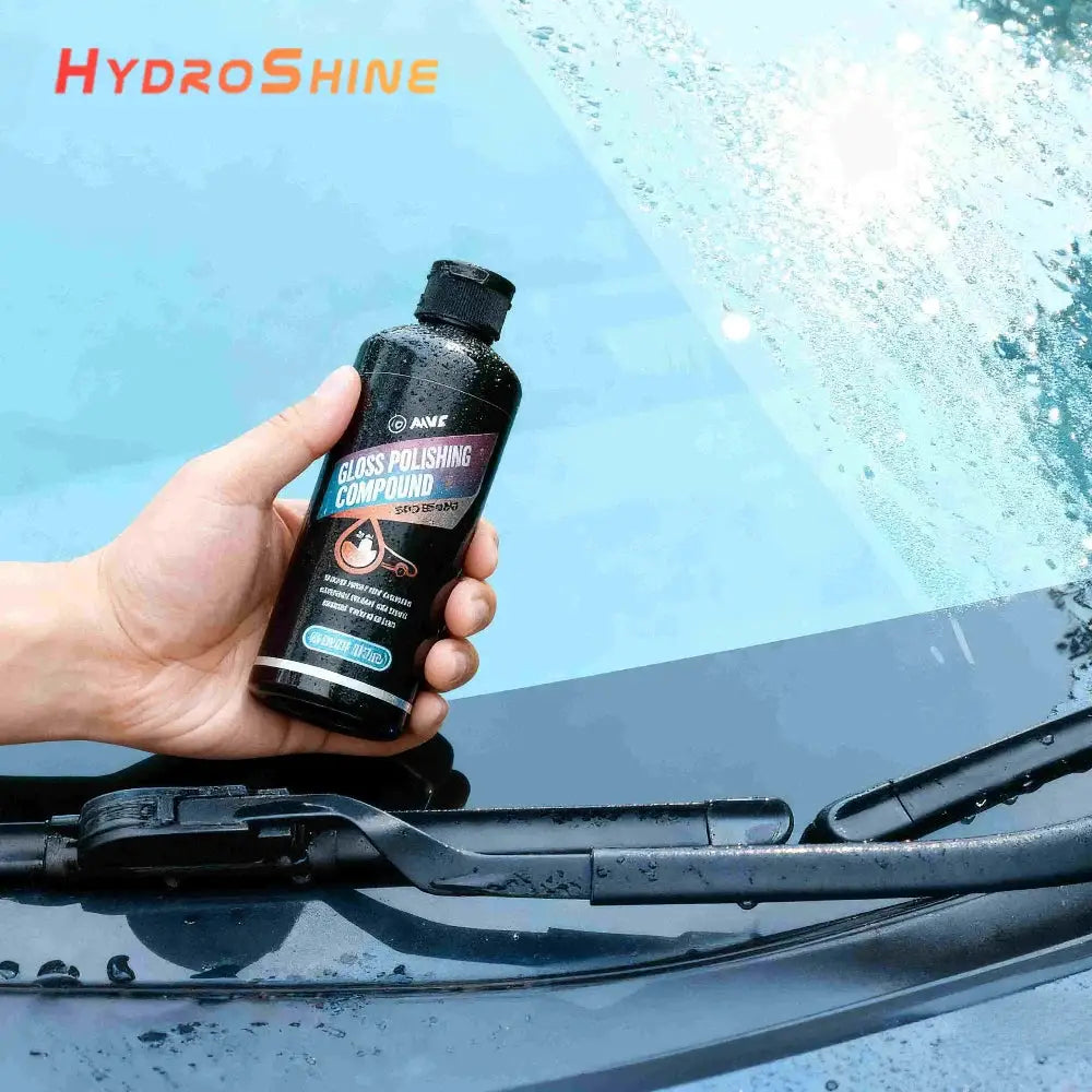 Gloss polishing compound bottle for car glass; black bottle with blue label and HydroShine branding.