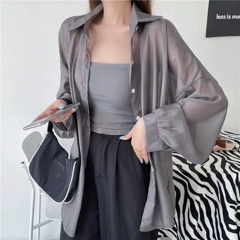 Xpqbb sheer gray long-sleeve blouse with oversized sleeves, worn over a gray strapless top