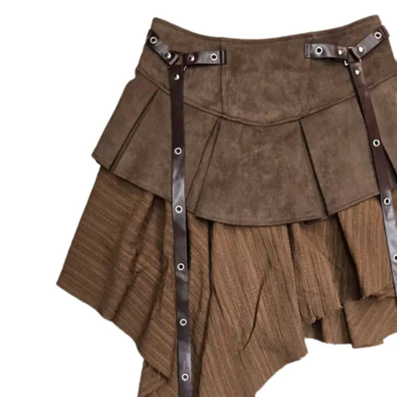 Short brown pleated skirt with layered suede panels and metallic strap detailing