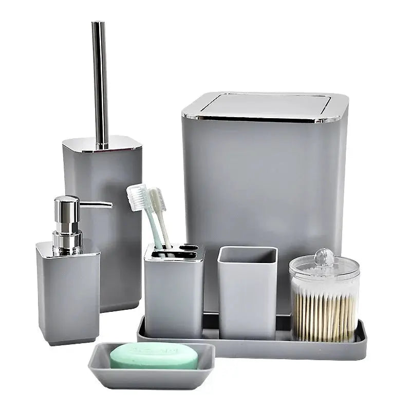 8-piece bathroom storage set in gray plastic; includes soap dispenser, toothbrush cup, lotion bottle, trash can, toilet brush.