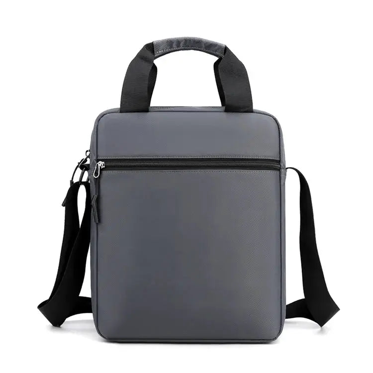 Men's grey crossbody bag with top handles and adjustable shoulder strap, front zip pocket.