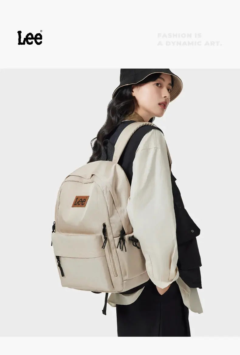 Lee lightweight 16-inch laptop backpack in beige Oxford fabric with multiple pockets and a Lee logo patch.