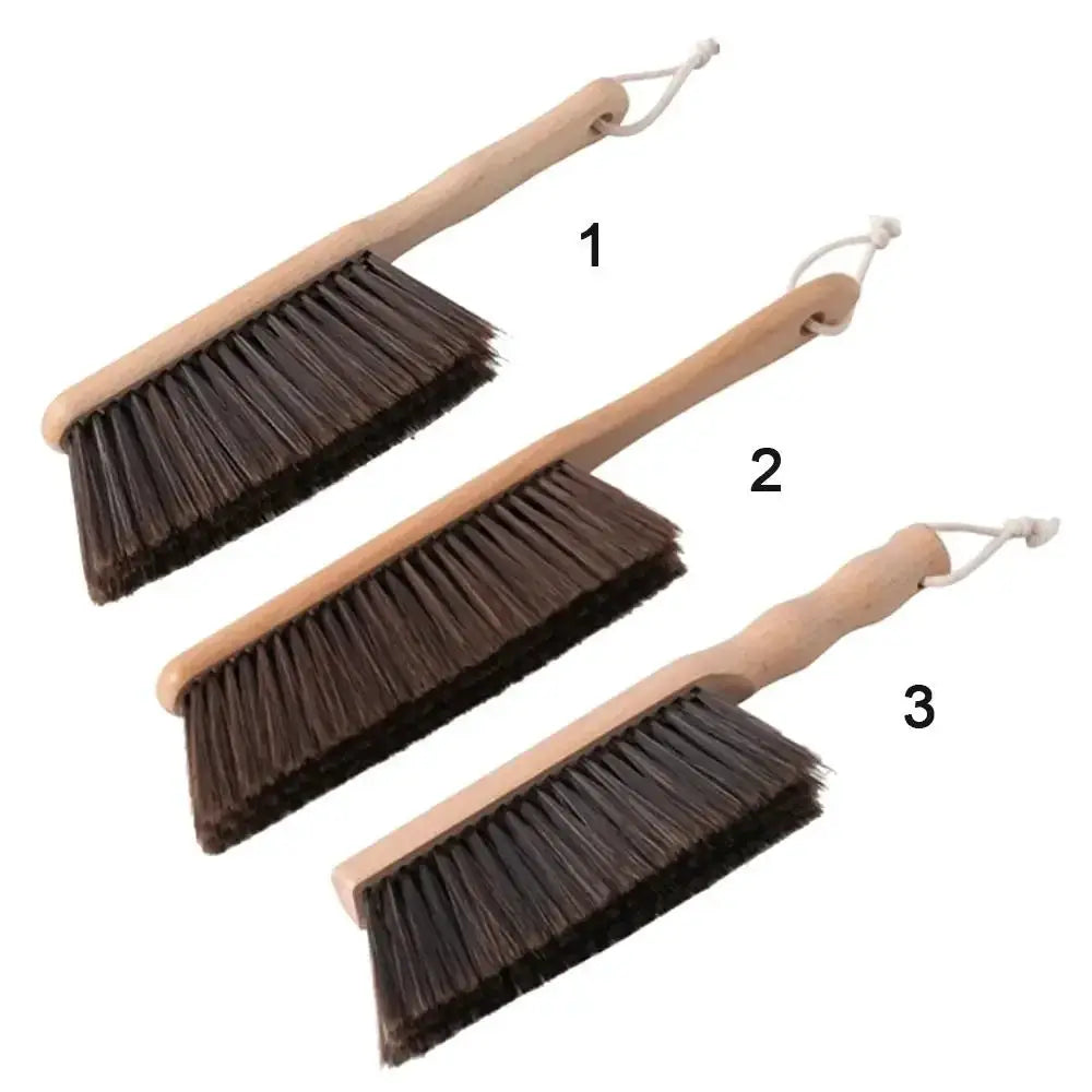 3-piece set of wooden-handle brushes with dark bristles and hanging loops for desktop cleaning