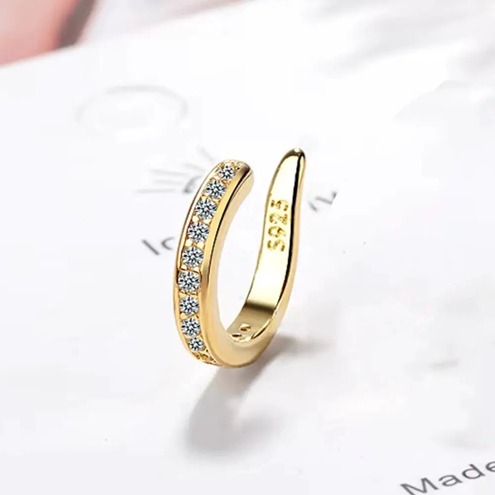 Gold-tone zircon clip-on ear cuff with row of clear stones, non-pierced hoop for women.