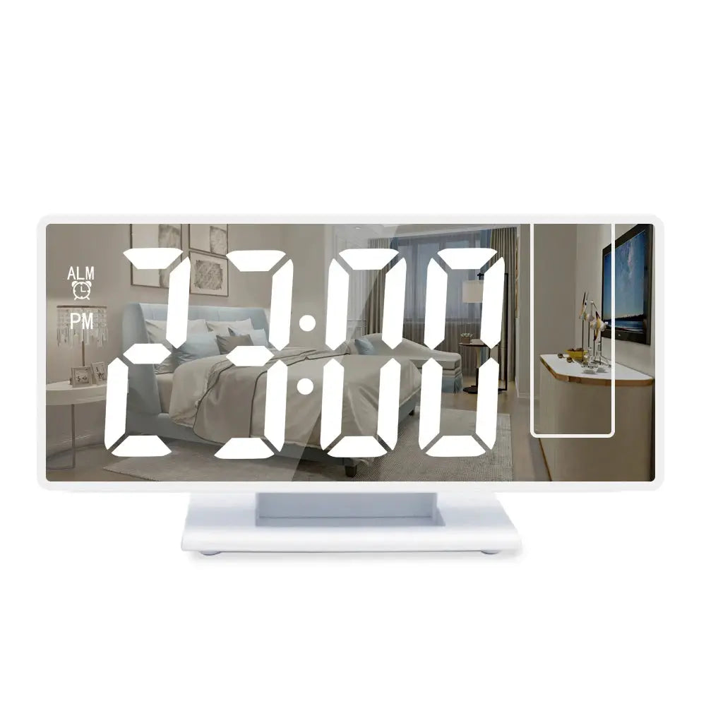USB powered digital alarm clock with 180° projection, white finish, large LED time display on a bedside table.