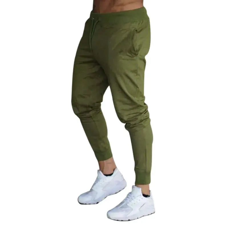 Men's olive green joggers with drawstring waist and cuffed ankles for gym workouts