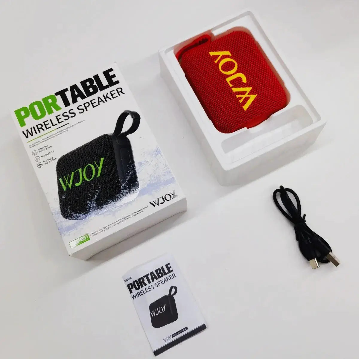 G04 portable wireless speaker, red compact Bluetooth speaker in its box with USB-C cable and manual