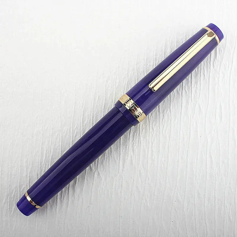 Jinhao 82 purple acrylic fountain pen with gold trim and clip, capped with converter included.