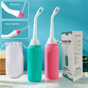 Two portable bidet bottles in turquoise and pink with white nozzles from Simples Market