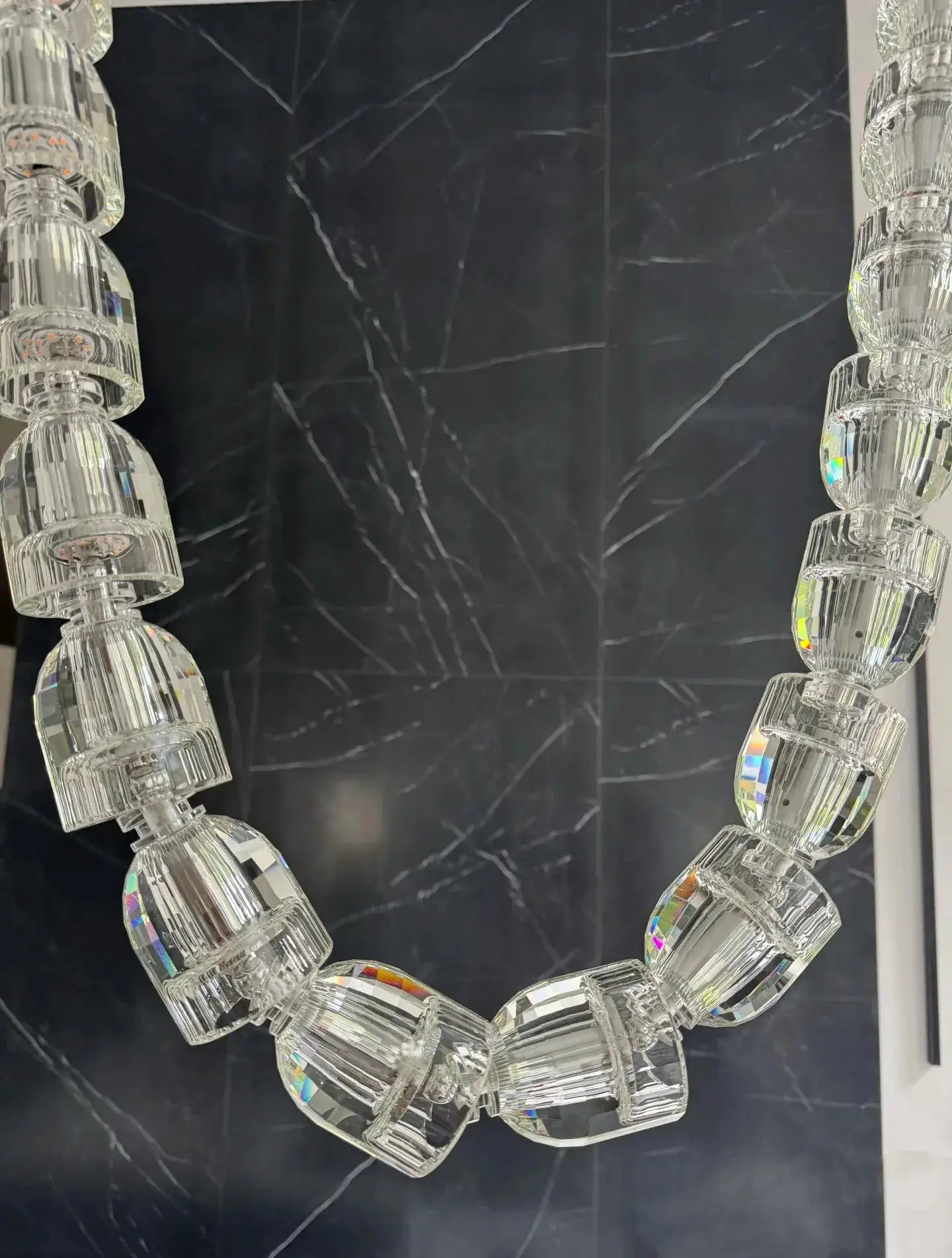 Necklace-style crystal chandelier light with multi-strand acrylic beads and adjustable chain for living room