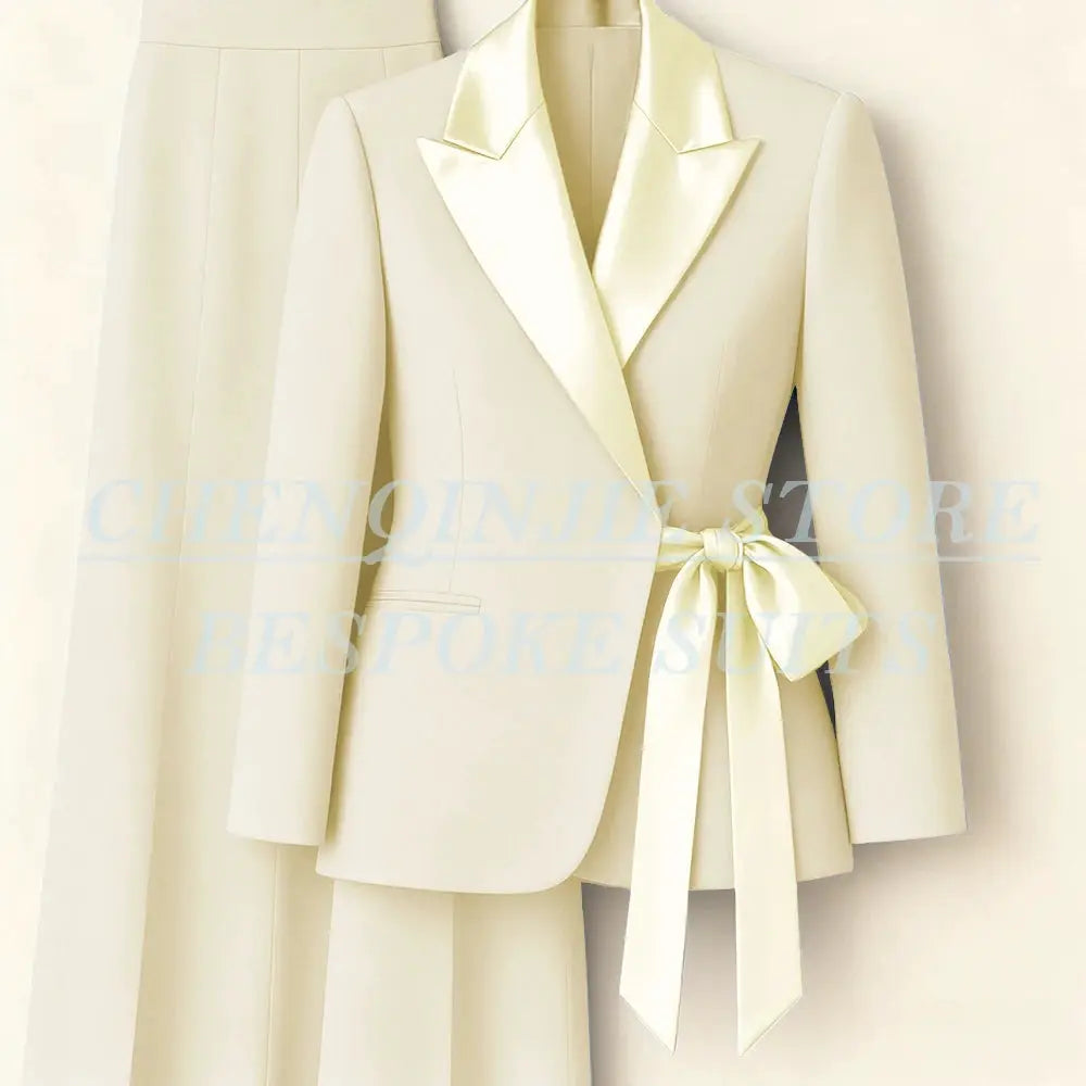 Cream 2-piece women's suit set with peak-lapel blazer and matching pants, waist-tie belt
