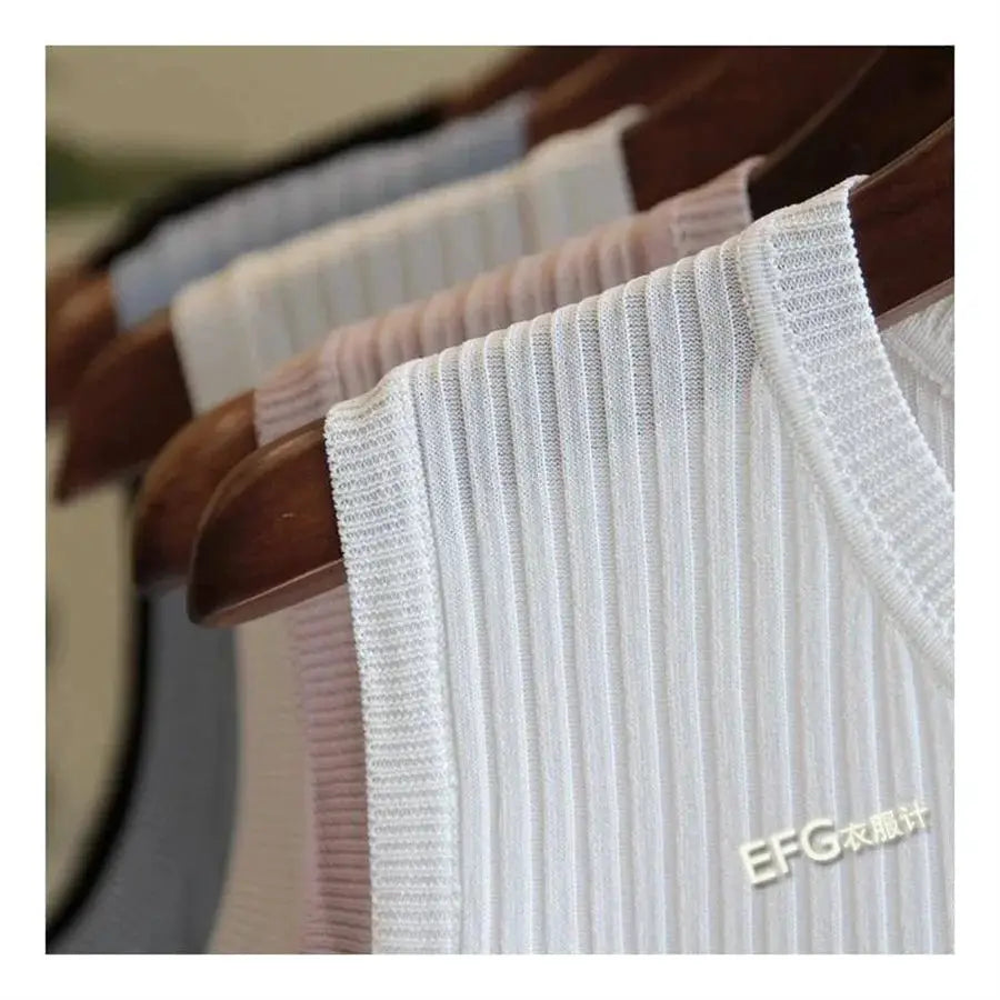 Five ribbed knit sleeveless blouses on hangers in white and pastel colors, EFG logo, Simples Market