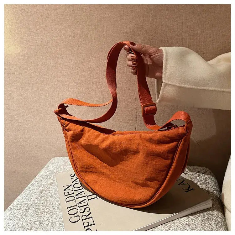 Casual nylon hobo crossbody bag in orange with adjustable strap, large capacity