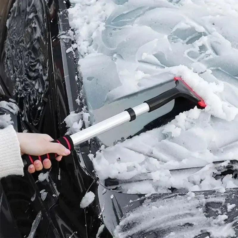 Extendable aluminum snow brush ice scraper by Simples Market with red head for car windshield.