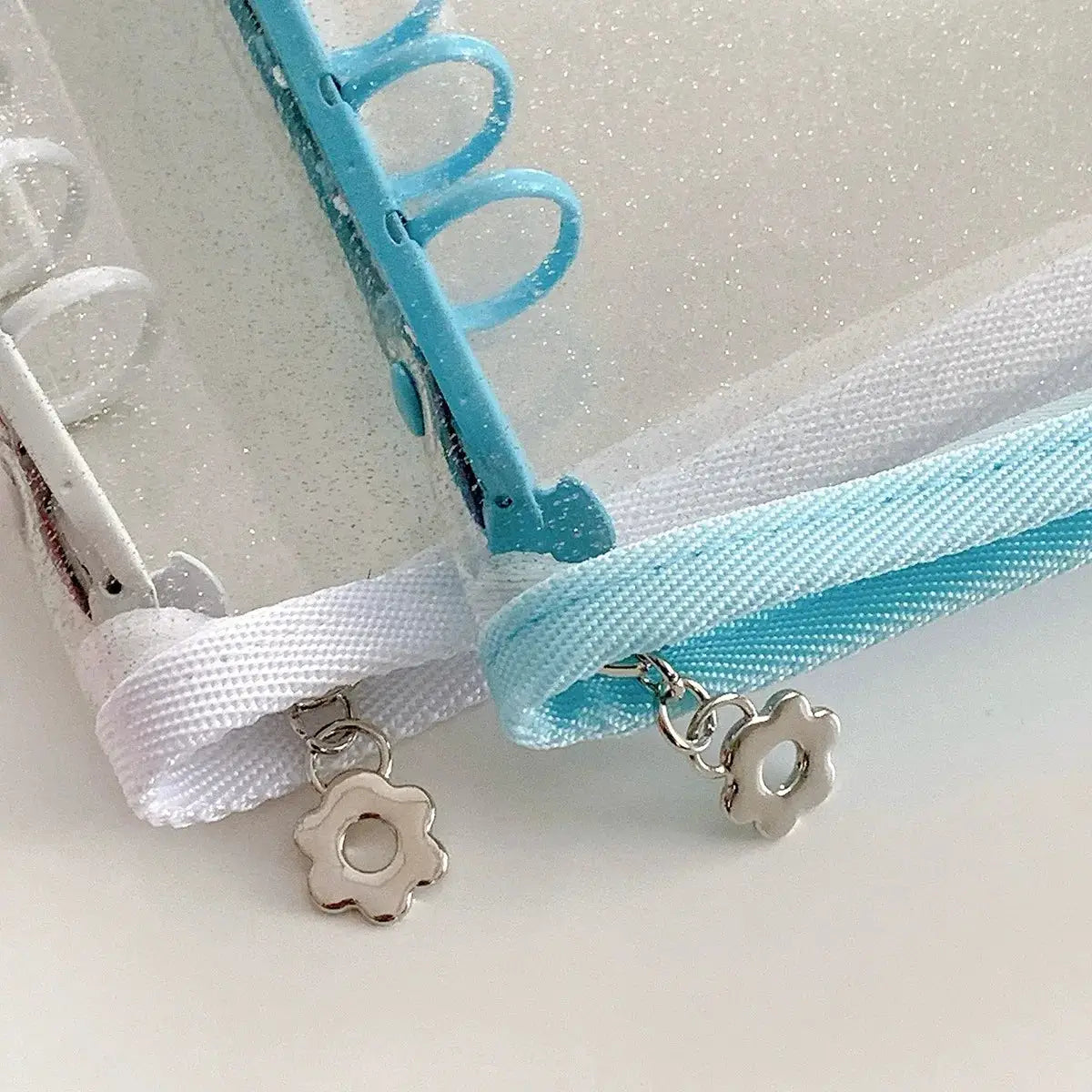A5 macaron binder with transparent cover; turquoise ring binder with white and light blue ribbons and two flower charms