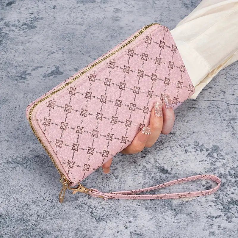 Pink textured wallet clutch with gold zipper and wrist strap; long, large-capacity multifunctional purse.