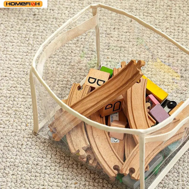 Homefish transparent toy storage basket with wooden train tracks and blocks inside