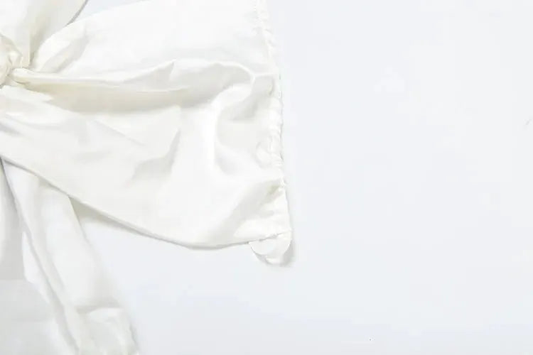 Jumpsuit white silky fabric showing knotted detail