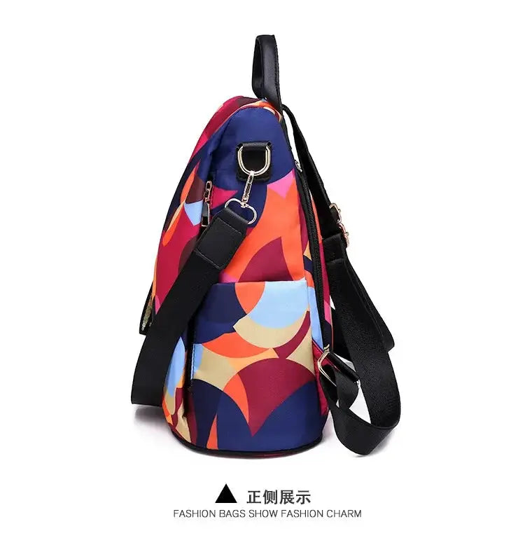Women's backpack with bold multicolor geometric print on Oxford cloth and black adjustable straps