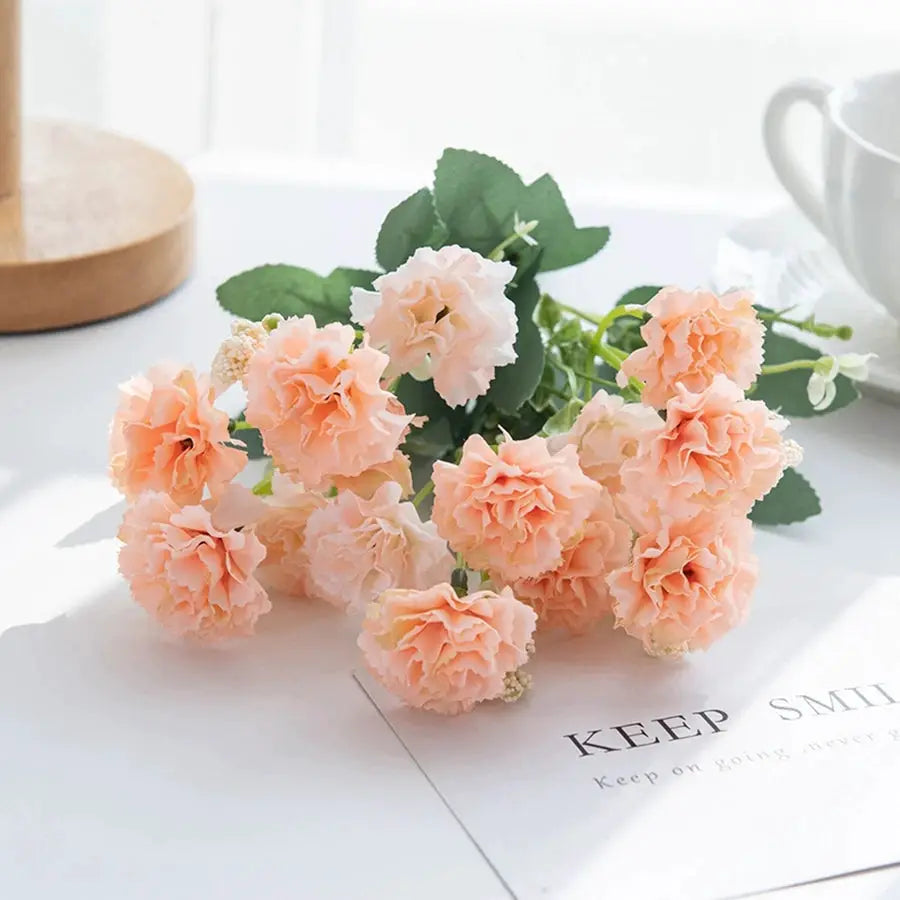 Artificial peach carnations bouquet with 15 heads and green leaves
