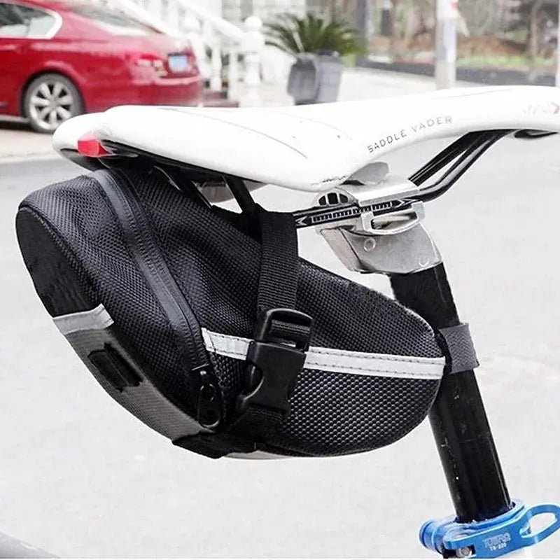 Waterproof bicycle saddle bag attached to a bike seat, showcasing its sleek design and secure fit for essentials.