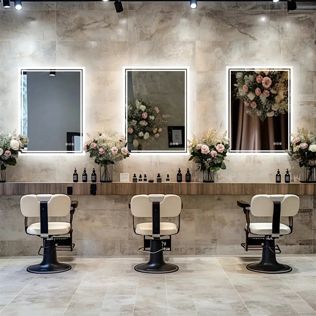 LUVODI Illuminate LED backlit frameless bathroom mirrors, set of three, displayed in a stylish salon.