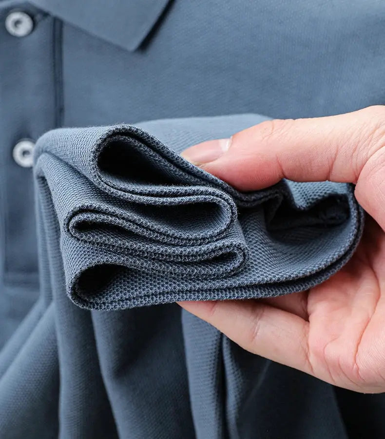Polo shirt navy blue, 100% cotton, folded sleeve with textured pique knit.
