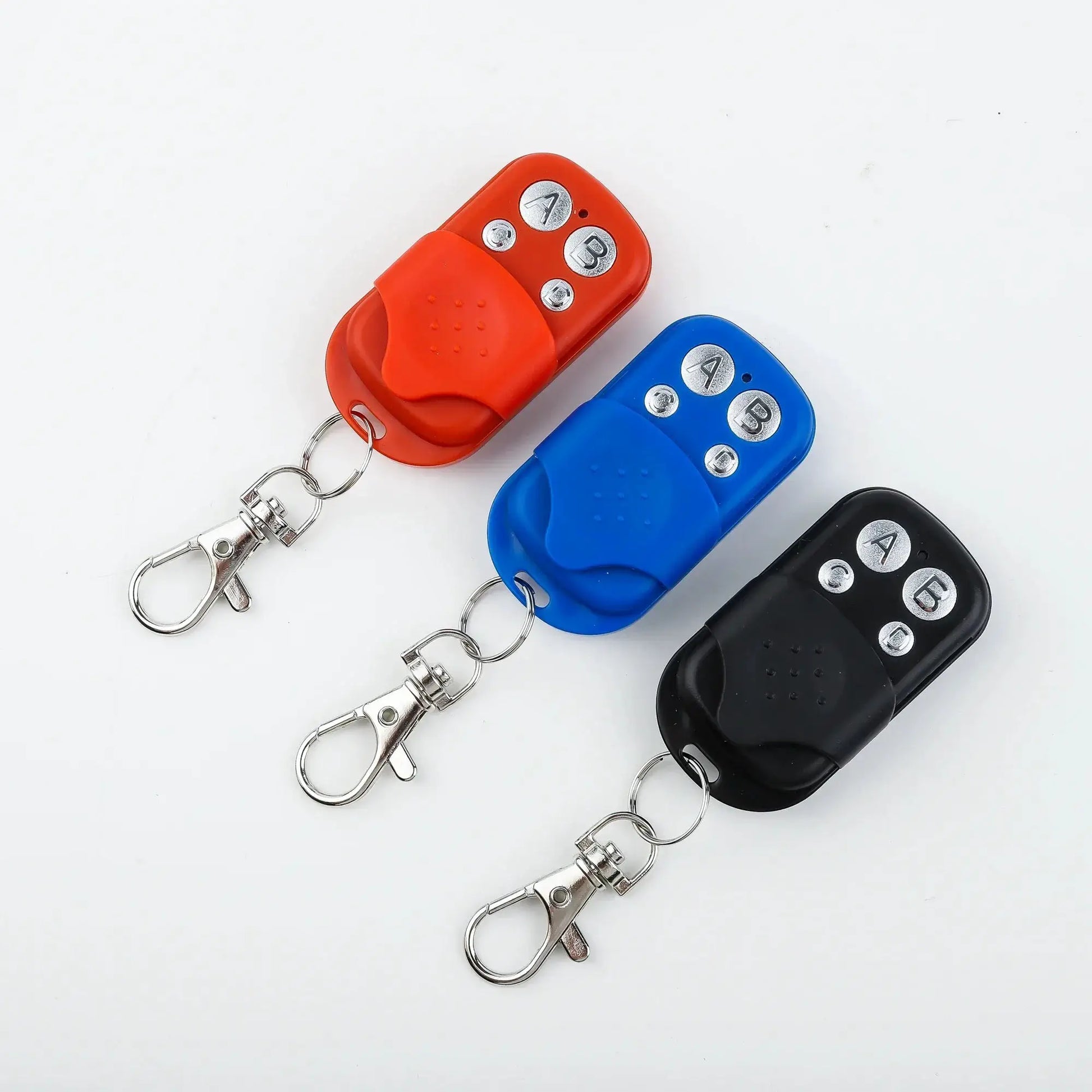 Universal garage door remote control fob set of 3 in orange, blue and black with metal button pads and key rings