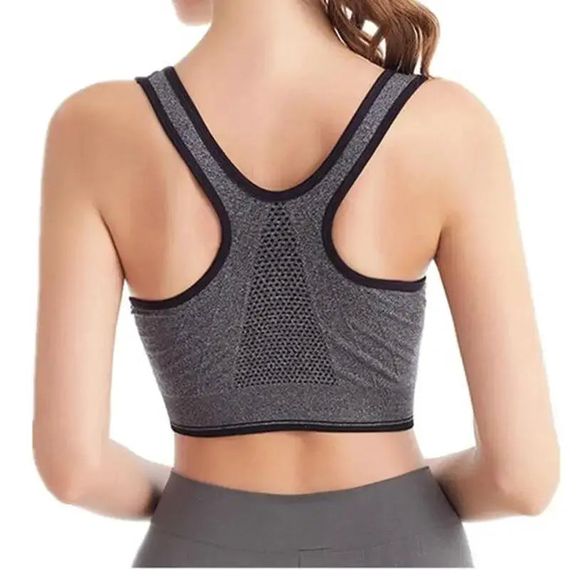 Sports bra back view, gray heather with black trim, racerback with breathable mesh panel, seamless design.