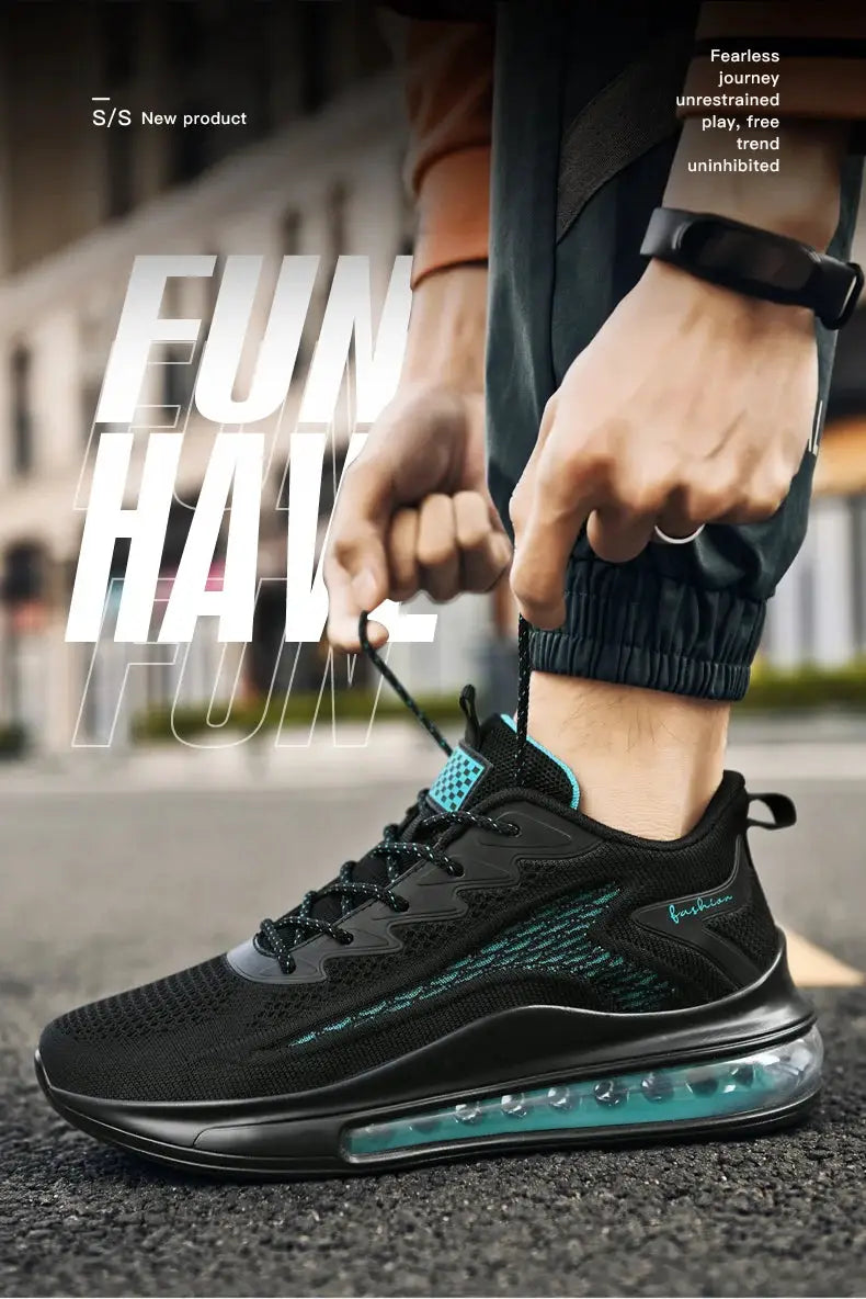 Men's black running sneakers with teal accents and visible air-cushion sole.