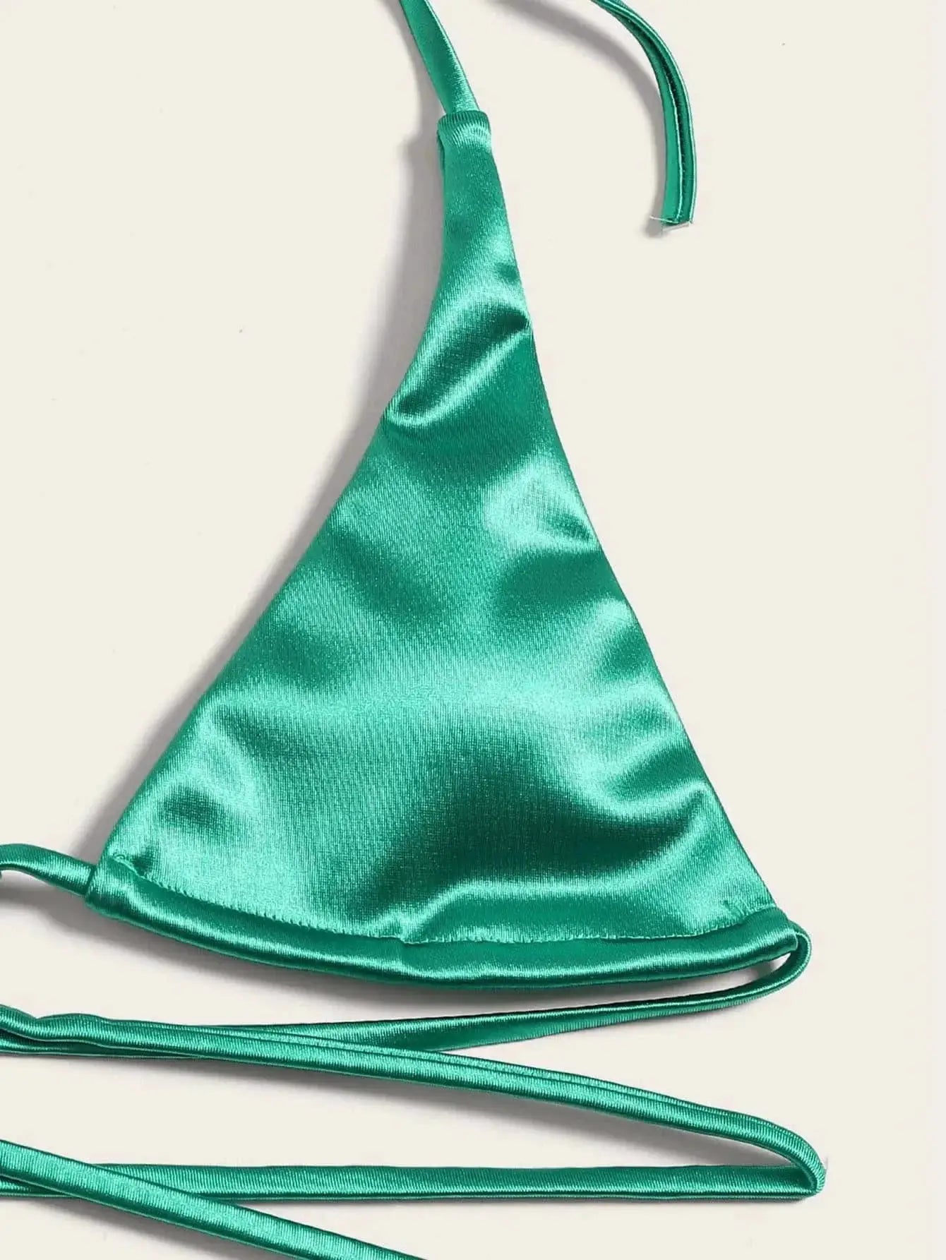 Halter bikini top in teal metallic satin with long ties; part of a two-piece bikini set